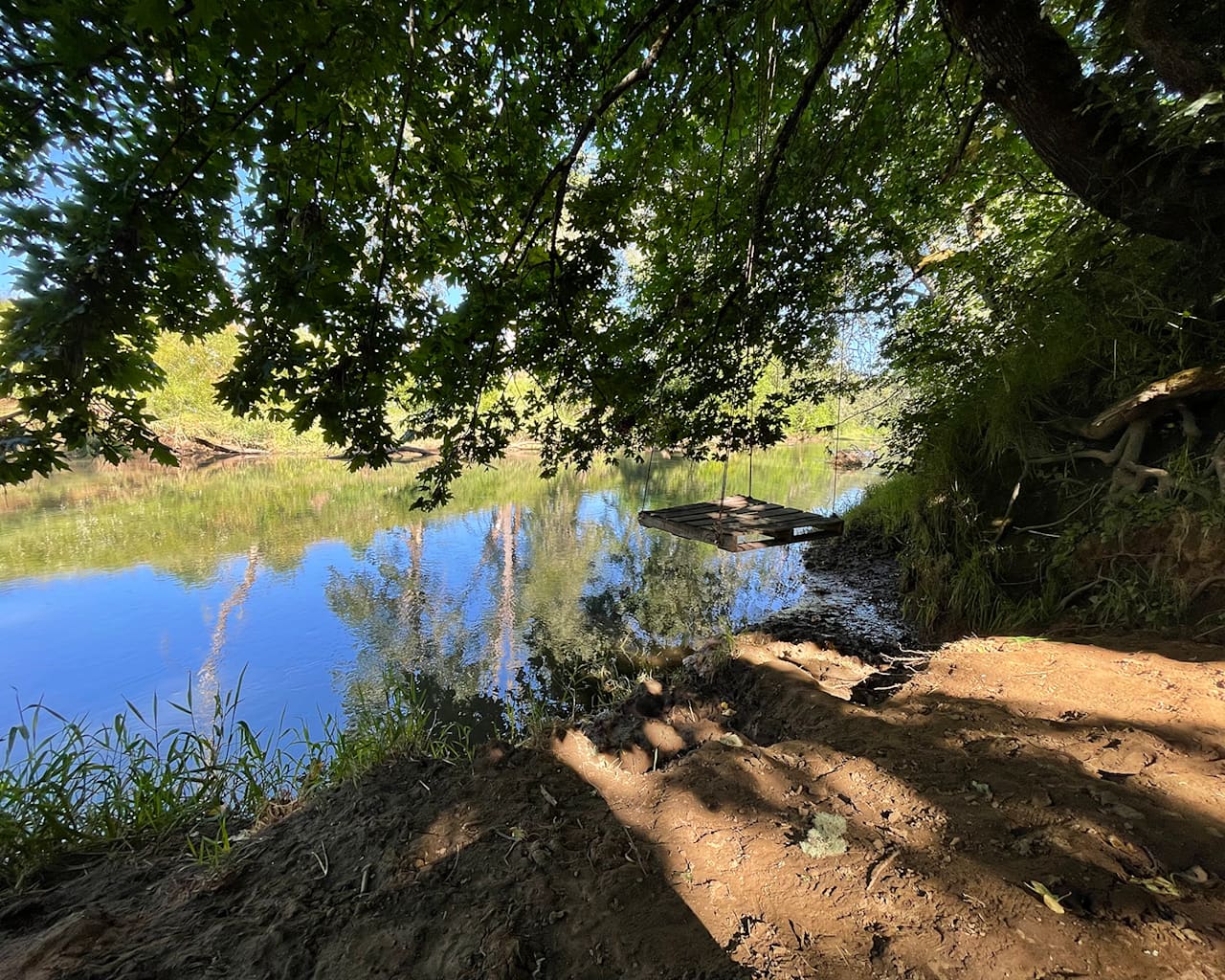 Private beach along the river edge. 