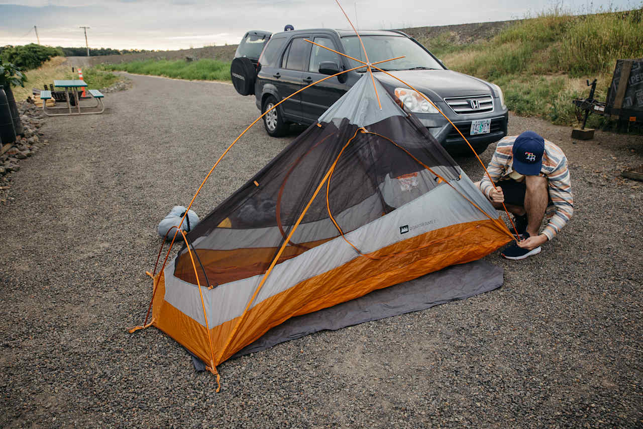 We set up our tents on the gravel parking lot instead of the grass field because we wanted to be close to the firepit and toilets at night.