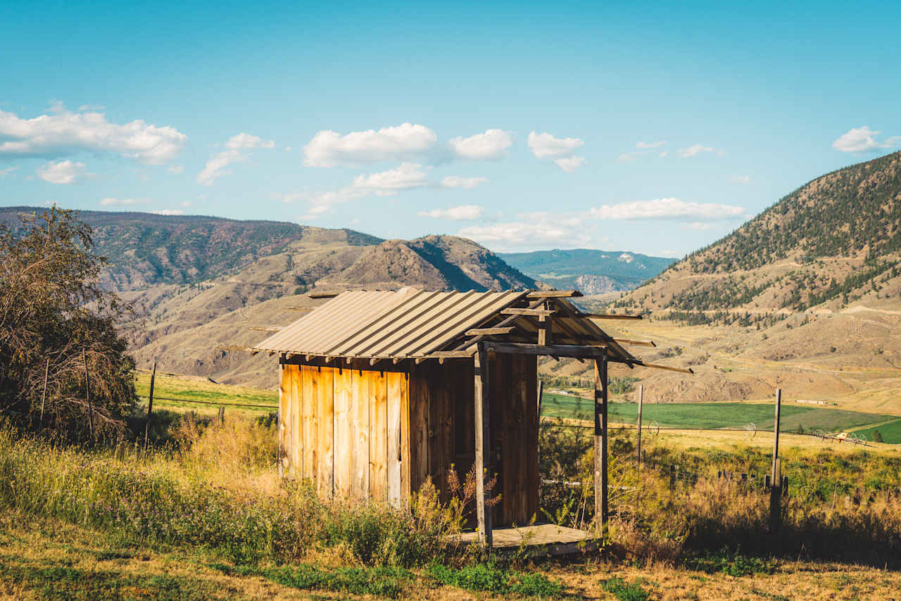 The outhouse near the garden. 