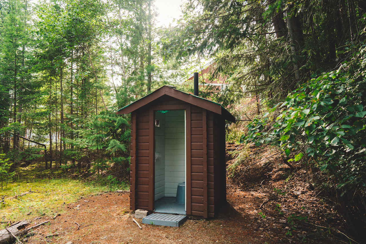 The current-closest outhouse to the property, located across the street at the lake. 