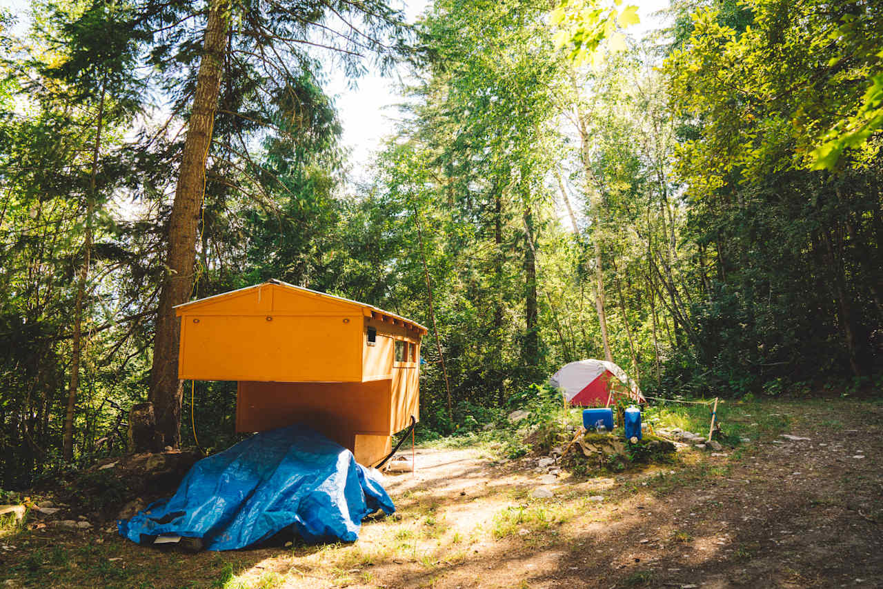 One of the forested, drive-in sites, seemingly occupied by a long-term stay. 