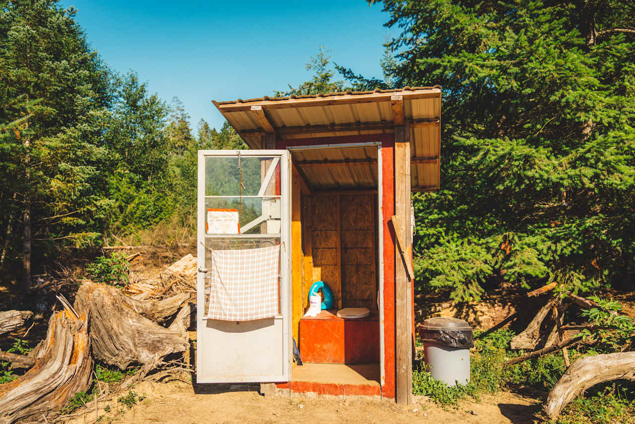 The outhouse located near the horse barn. 