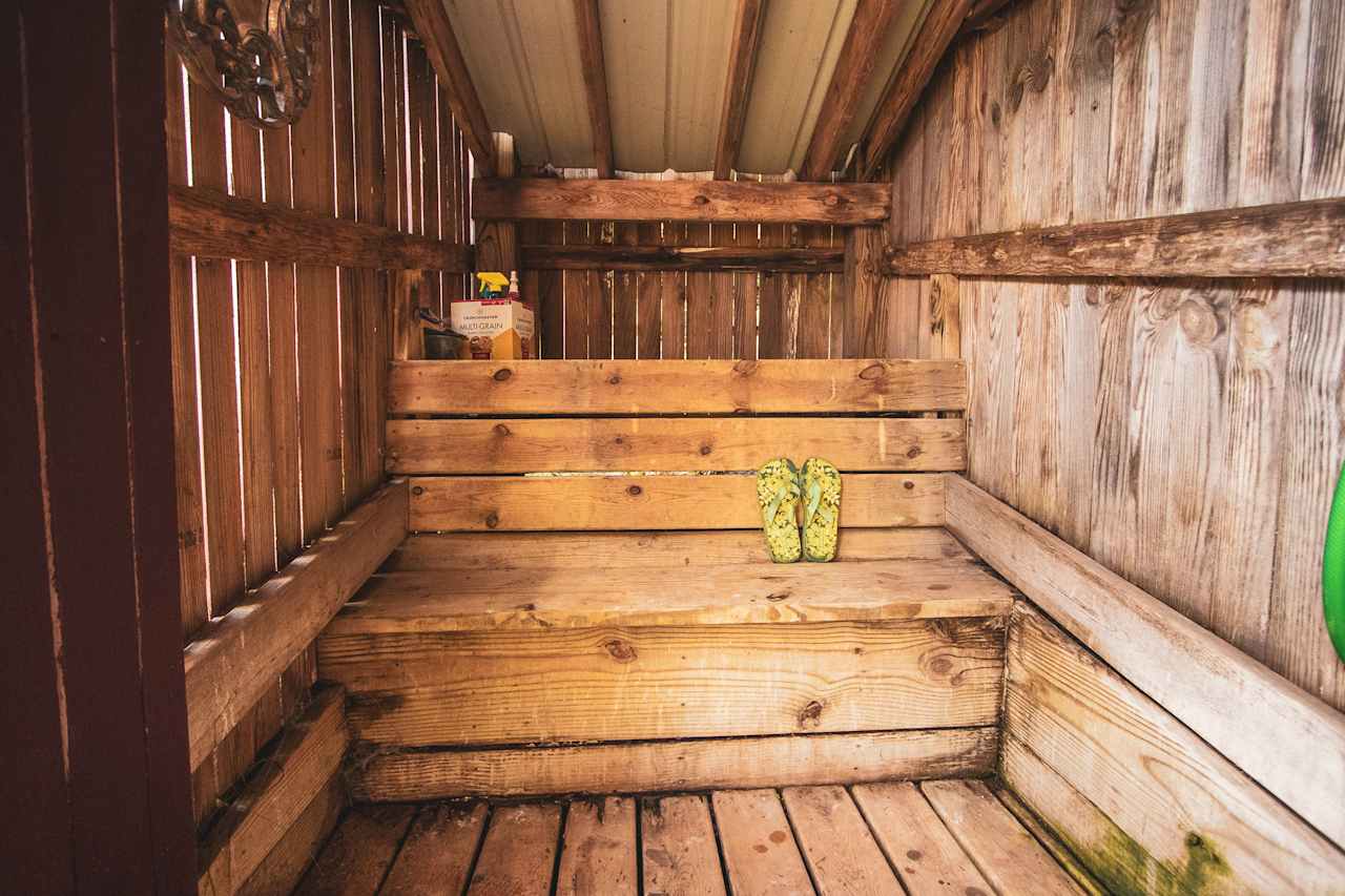 There is a large bench in the shower