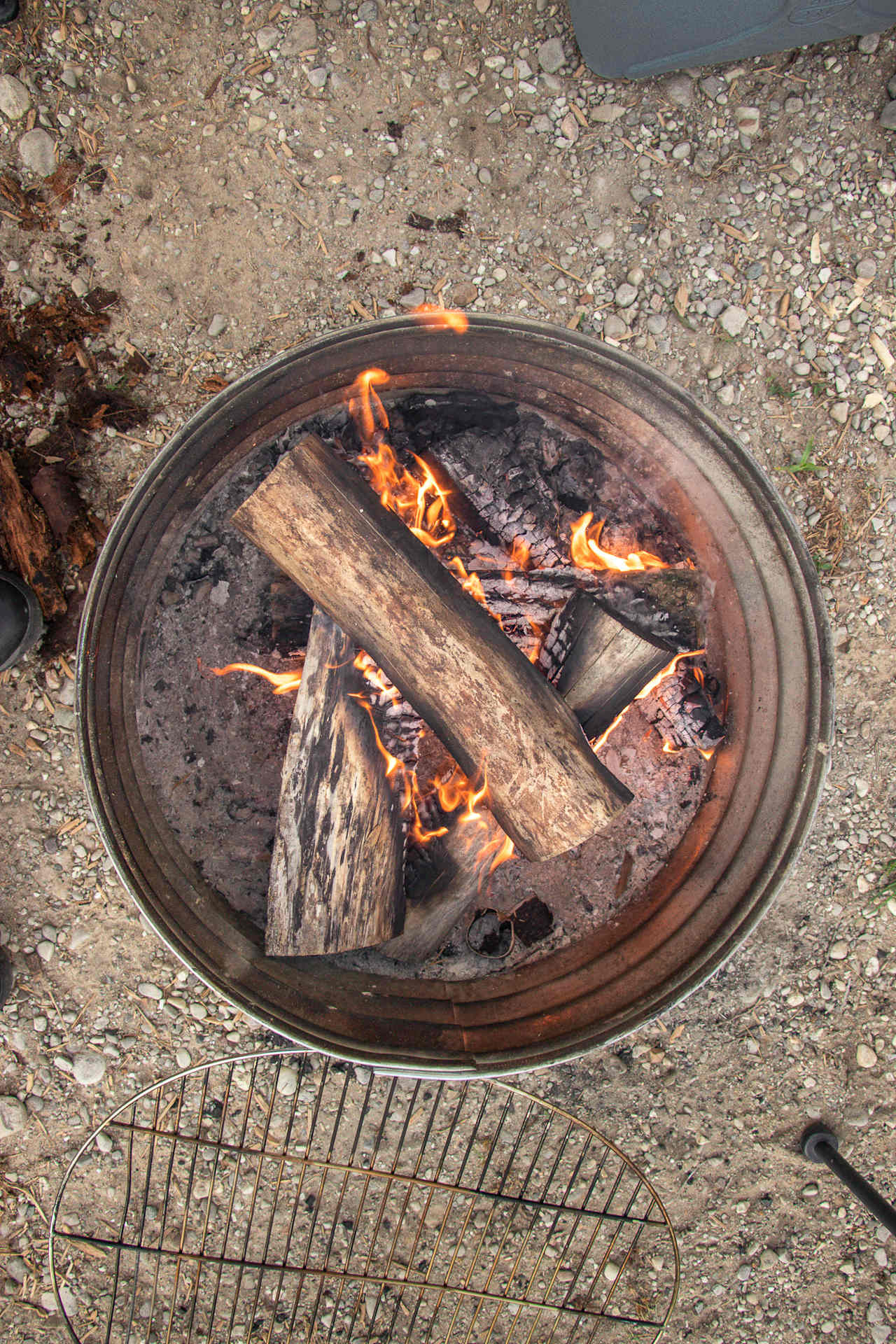 There is a firepit with provided firewood