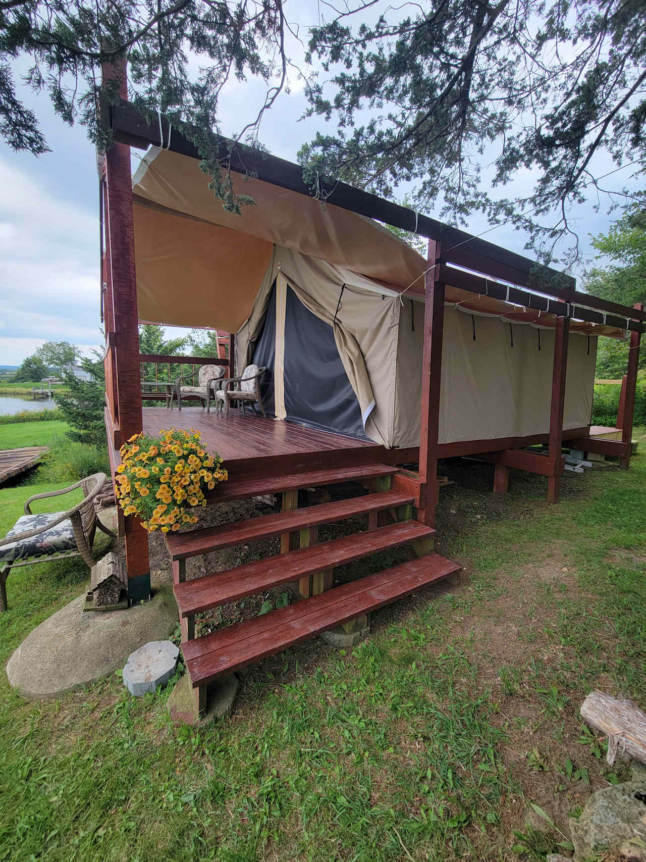 Front entry. Zippered mosquito netting on both ends  Beautiful pond setting and access.