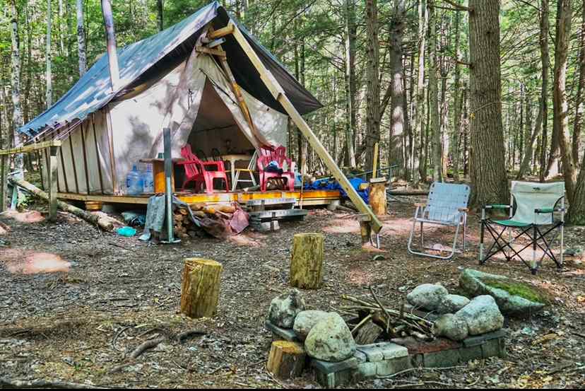 Fire pit and lounge area outside the tent 