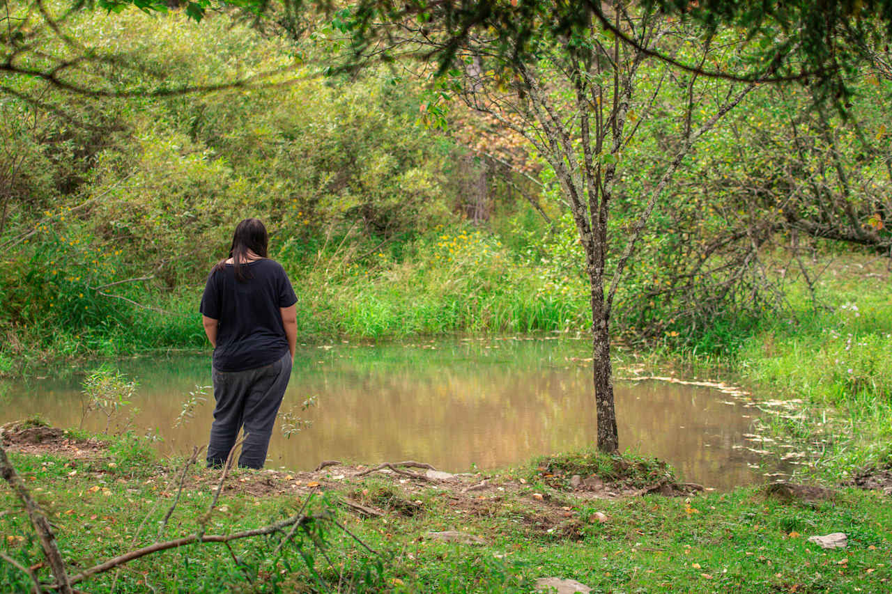 There is a small pond down the hill