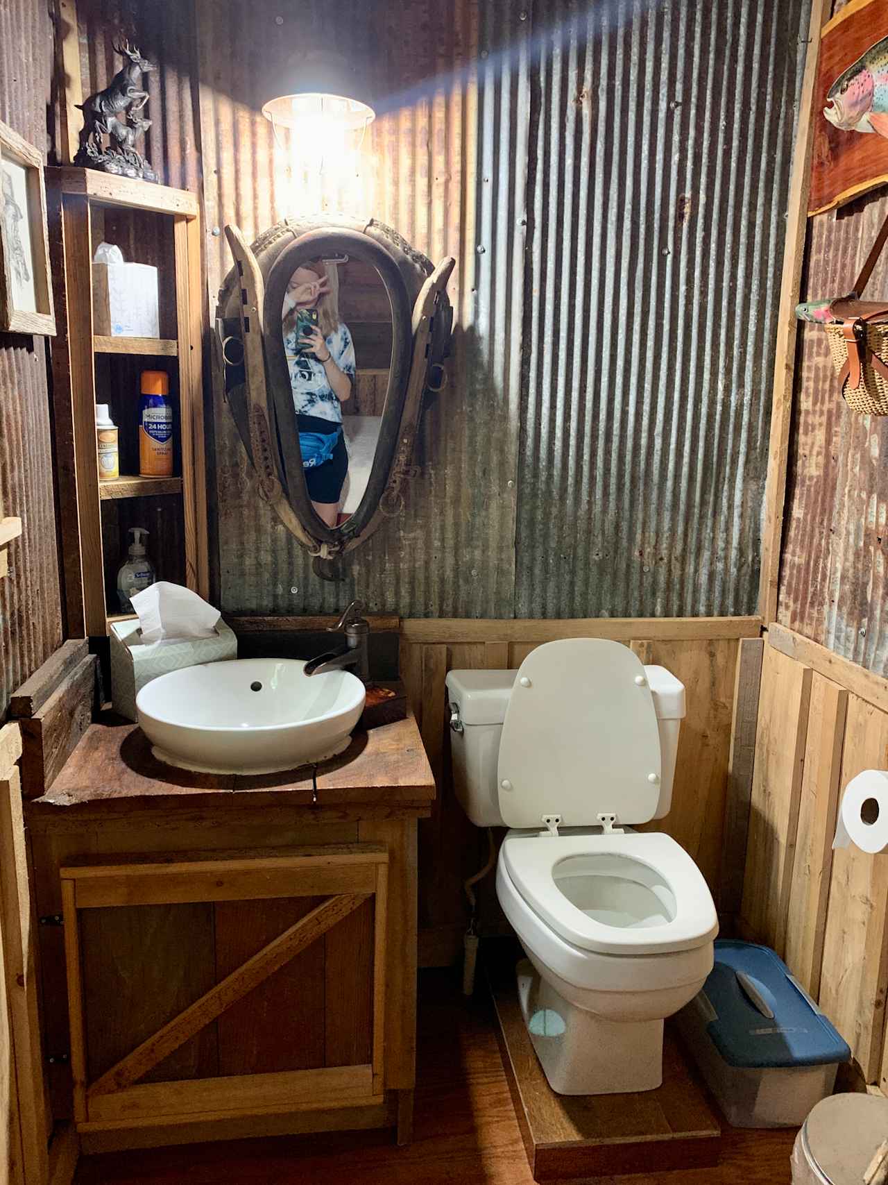 Neat little bathroom area, stocked with plenty of TP, linens, soap, and air freshener