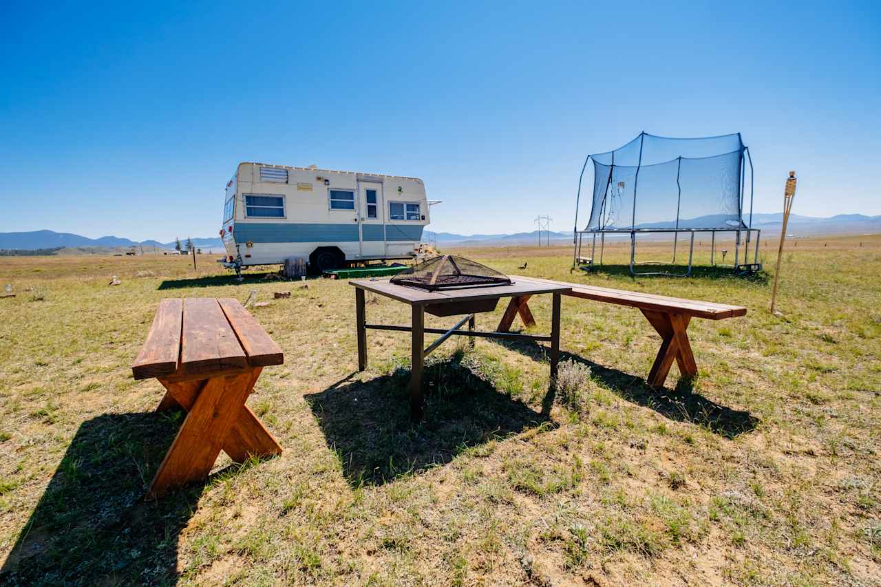 Firepit, trampoline and camper