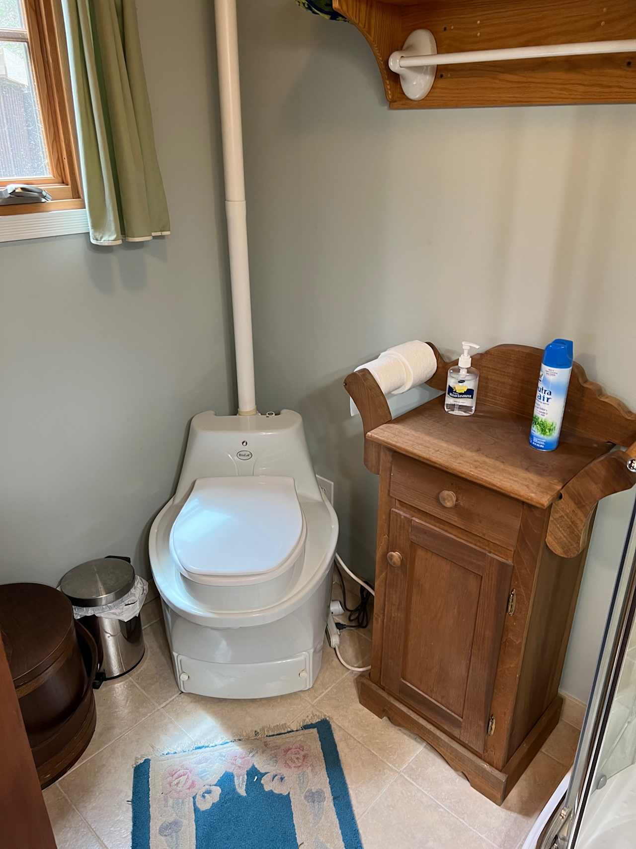 Bathroom showing composting toilet.