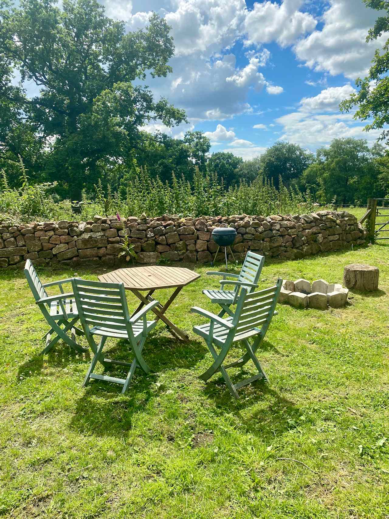 Our outdoor seating area complete with fire pit for toasting marshmallows by and the barbecue for those alfresco meals.