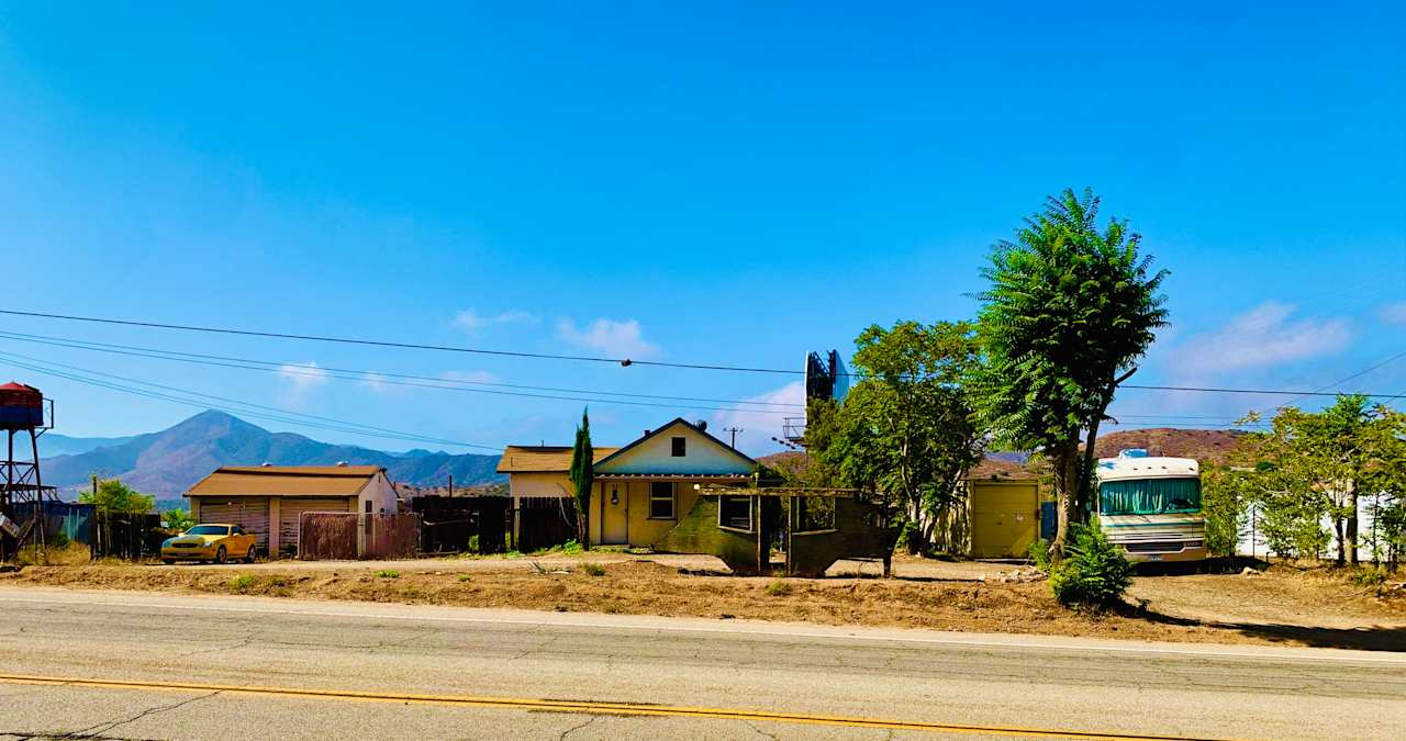 Our house is along Sierra Highway and you will be parking our driveway that you see, usually across the front of the house.