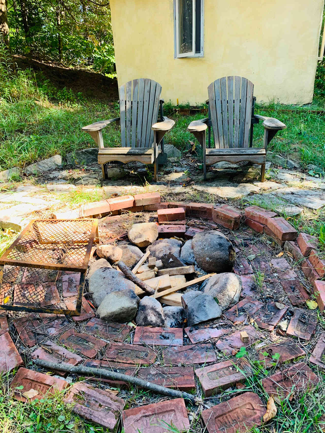 Fire pit with small cabin behind 