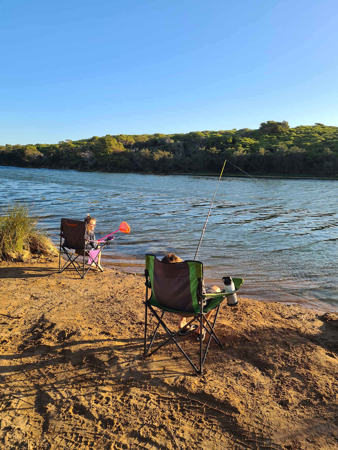 Fishing by the river adjacent to the property.