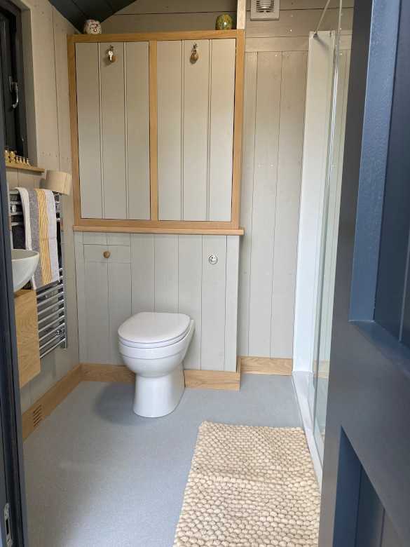 Shared flush toilet and hot shower block (shared between the 2 pods only)