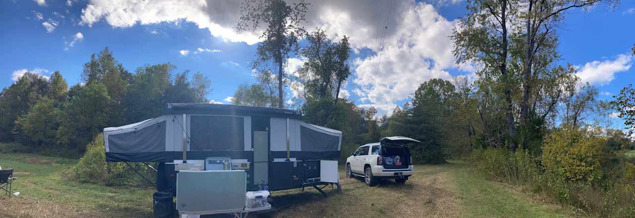 We camped down in the bottom near the creek, access road is pretty steep but smooth, should not be an issue for any 4x4. I took my beefed up small camper down and back up and was fine. Other RVs or campers should use the upper site. 