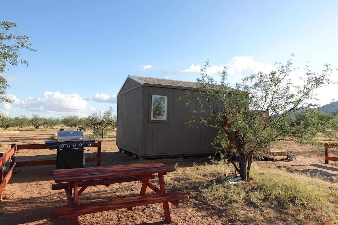 You have your own private backyard equipped with a grill, picnic table, hammock, firewood, and fire pit! 