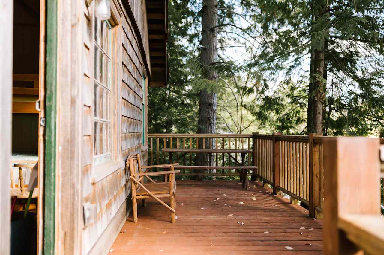 Front door into entry and deck overlooking Pipe Lake