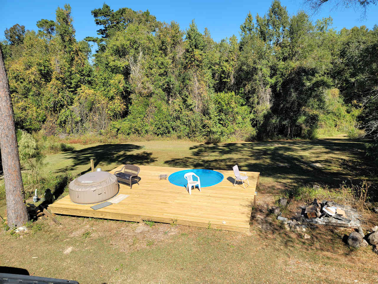 Hot tub and seasonal stock tank pool.