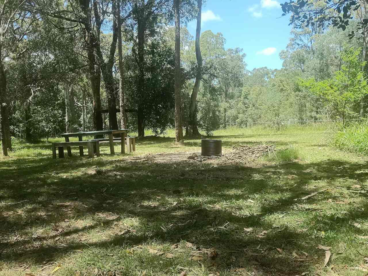 This site has a gravel circle with fire pit to sit around on cushions or chairs at the fire. There is a picnic table and Slackline and a few different sites in part shade to choose from 