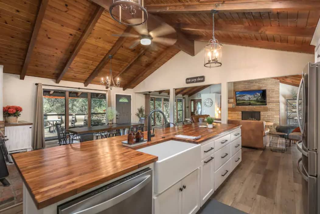 Enjoy together time while making a meal or picking up after on the beautifully updated butcher block island with large deep farmhouse sink.