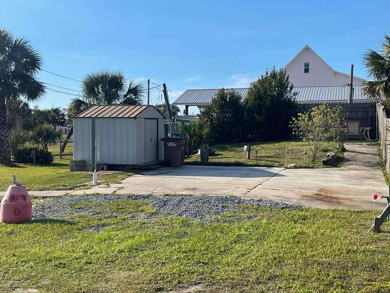 Large 30x30 concrete pad with shed and outdoor shower. 