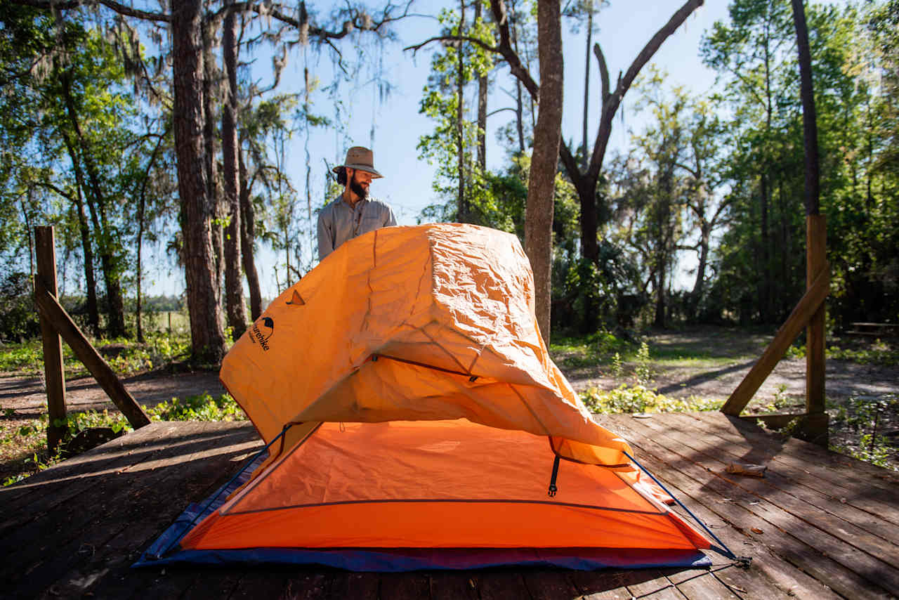 Setting up our tent on one of the many platforms available on the camp ground.