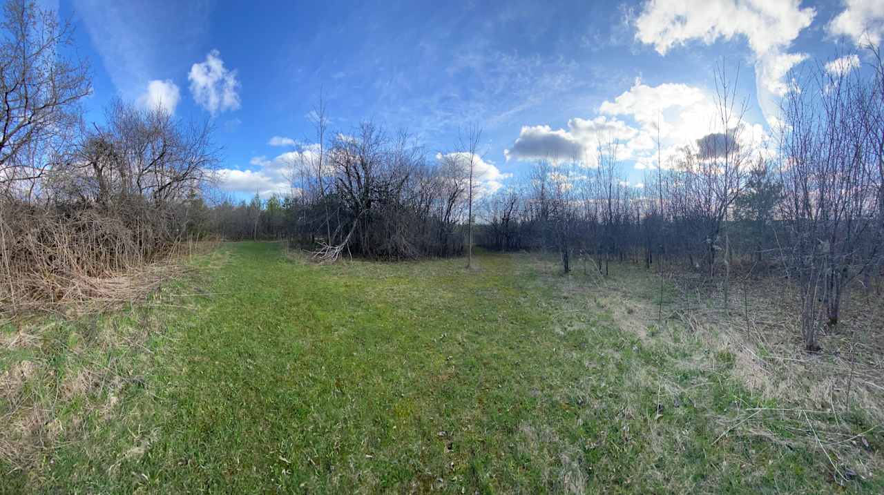 Site 7. Large flat area surrounded by forests and close to Hub and Site 2. 