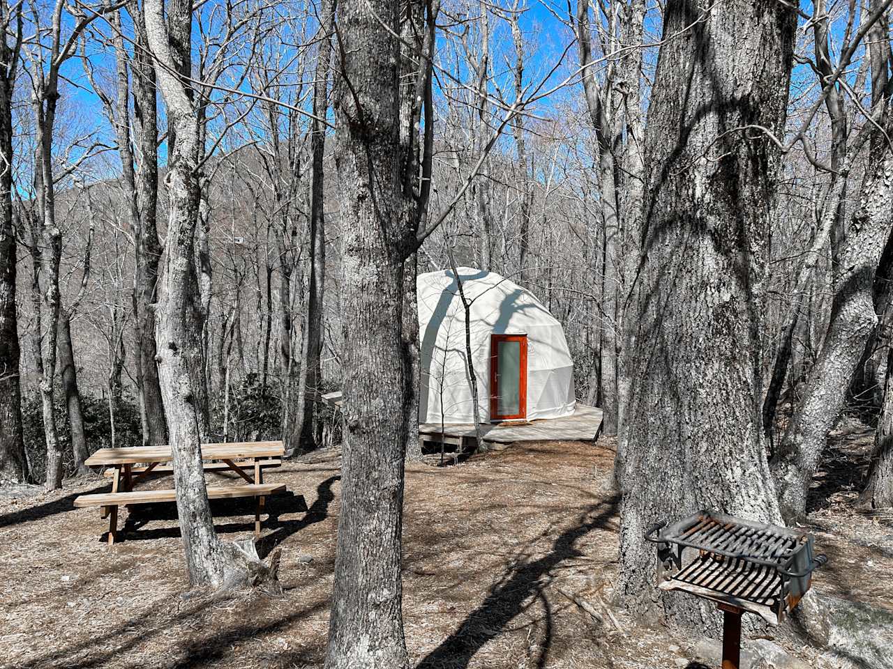 The Star Gazer Dome is a unique outdoor structure located in a tranquil, wooded area. This dome-shaped observatory is designed to provide a spectacular view of the night sky and surrounding forest. The dome is made of clear, weather-resistant materials that allow for an unobstructed view of the stars above, and is nestled in a shaded area to provide a comfortable, cool environment for stargazing. Whether you're an astronomy enthusiast or simply looking for a peaceful retreat, the Star Gazer Dome is the perfect place to marvel at the wonders of the universe.