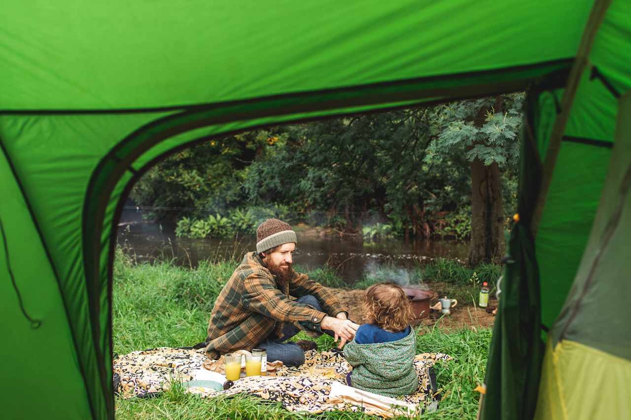 Enjoying a family breakfast with delicious treats from the farm and the sound of the river