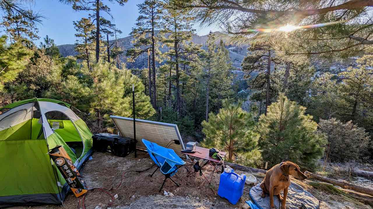 Looking WSW at sunset while working and camping at the site. Solar panels charge the batteries I use for the hand tools I bring. Some of this camping equipment is available to use, presently at an additional rate. 