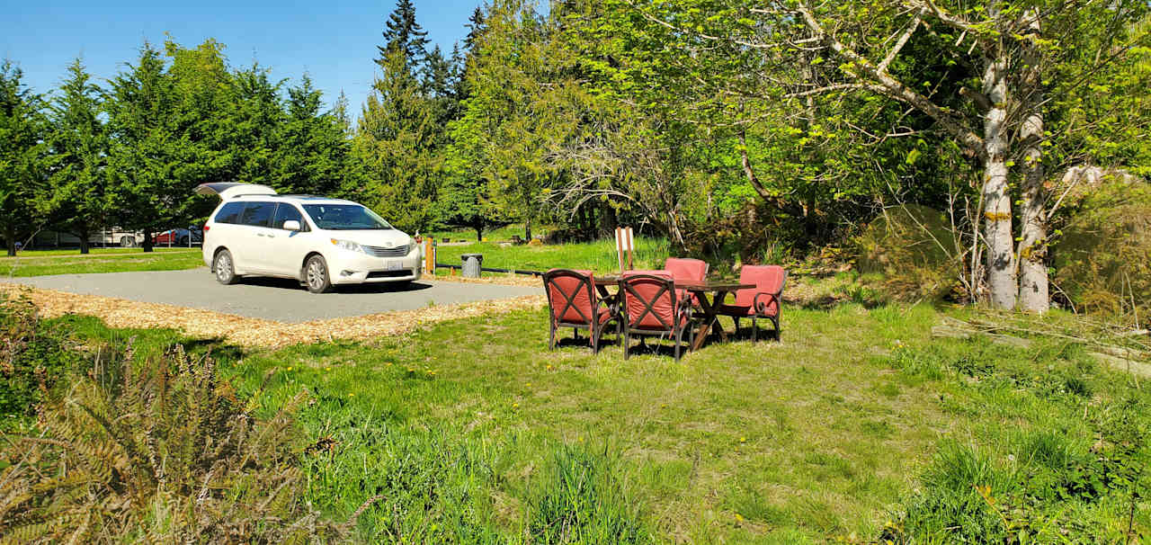 Private campsite in green meadow area. 