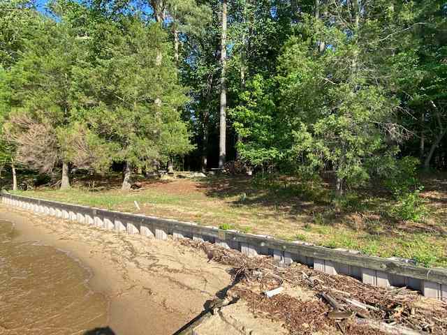 The fire pit is 20 feet from the shore. This is looking at Campsite #1. The size of the beach varies with storms, direction of the wind, etc. 