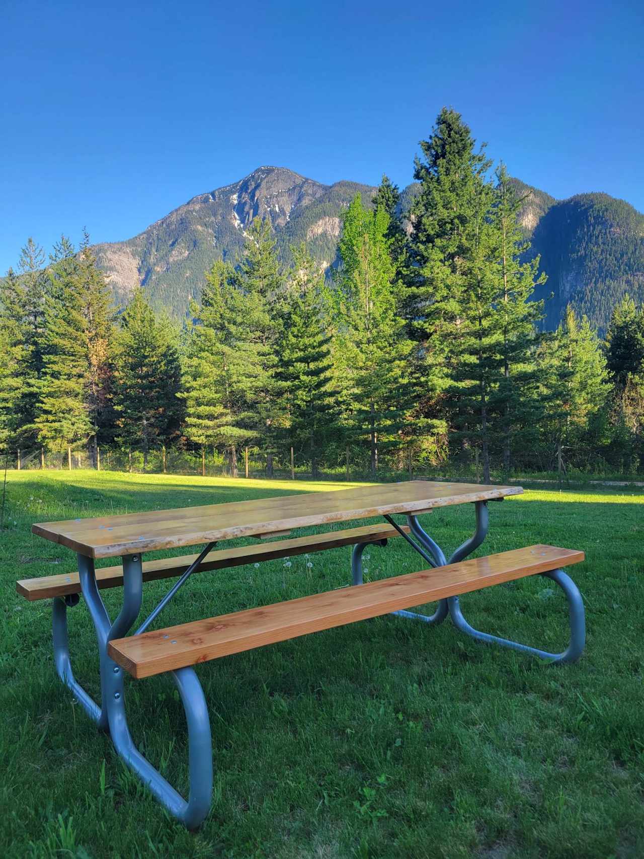 beautifully handcrafted picnic tables at each site