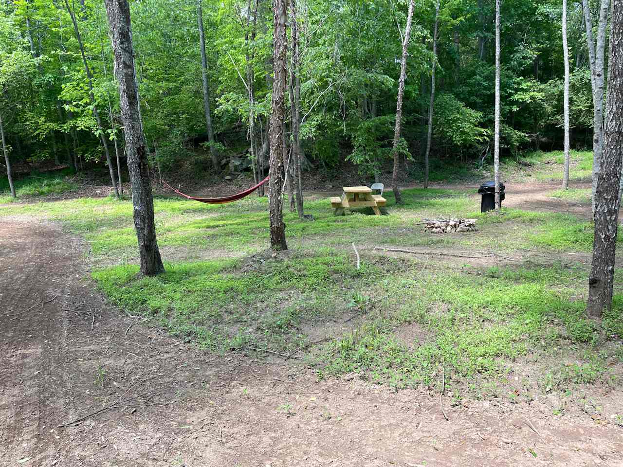 Another perspective of camp. The access road pictured on left can be used for extra tent space, screened area, or as a walk between Rock Ridge and Coyote Way campsites. Area perfect for larger groups; reserve #7, #8, and #9 for the entire center island!!