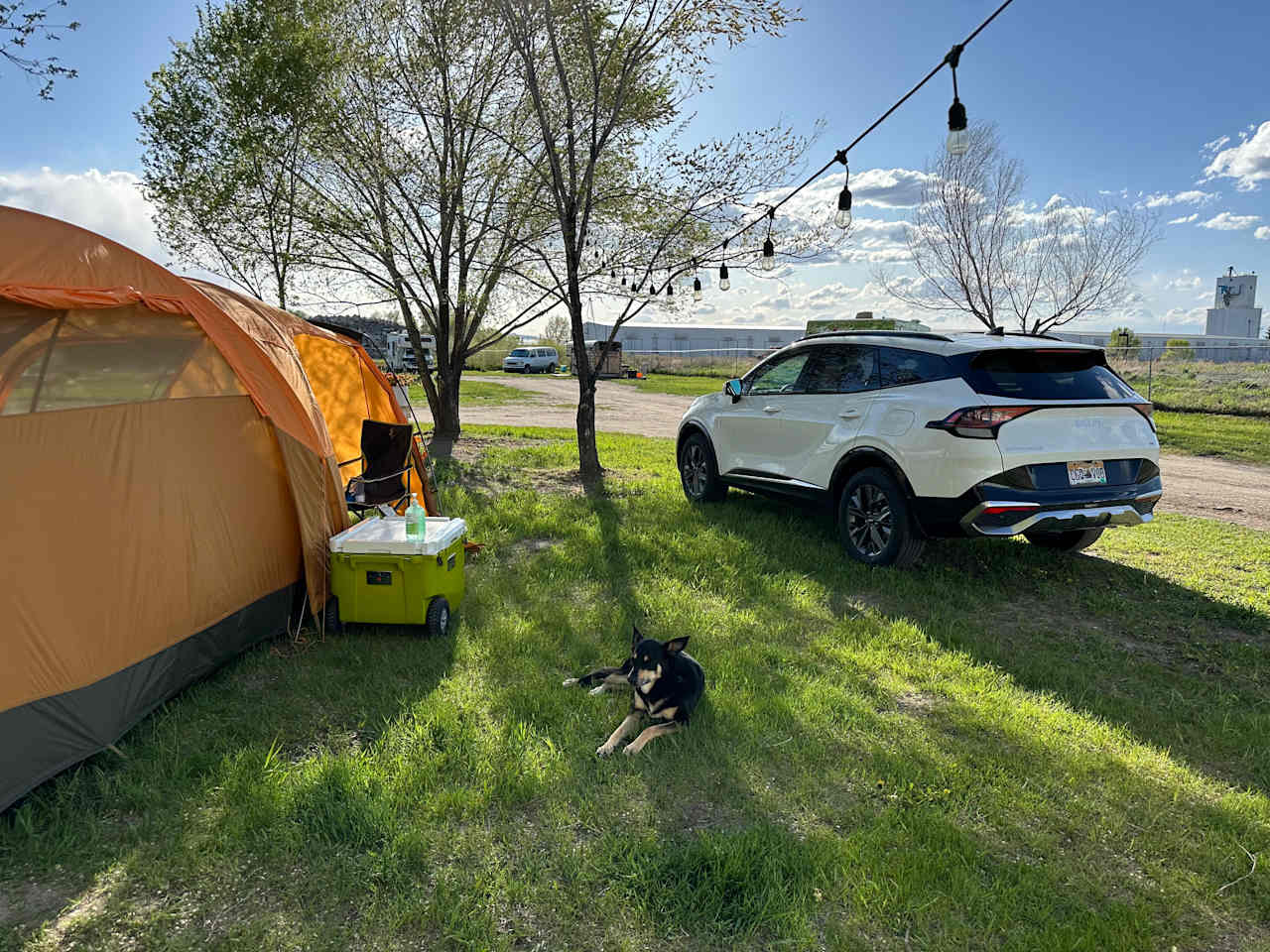 Best tent site with string lights, right near the gate