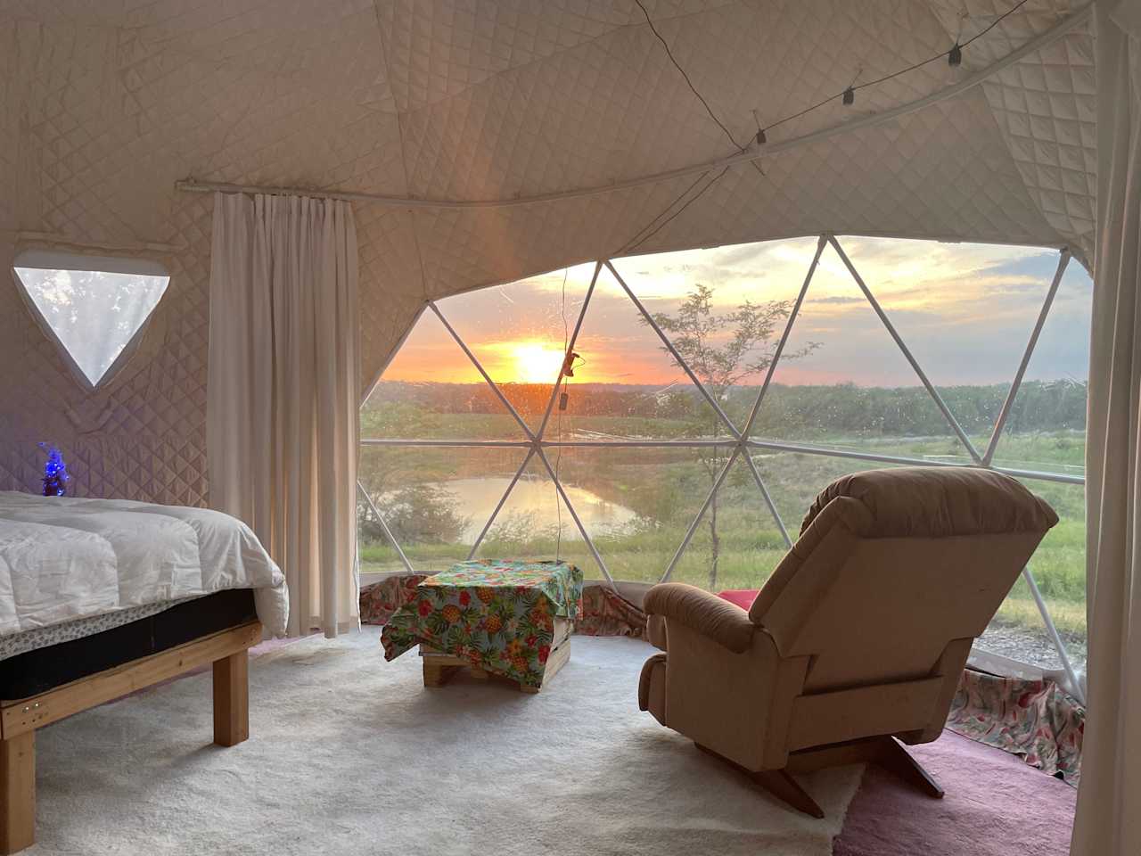 An amazing view of sunsetting can be viewed inside the dome if weather conditions permit. Inside dome has  king size bed, a sofa, a small table.  