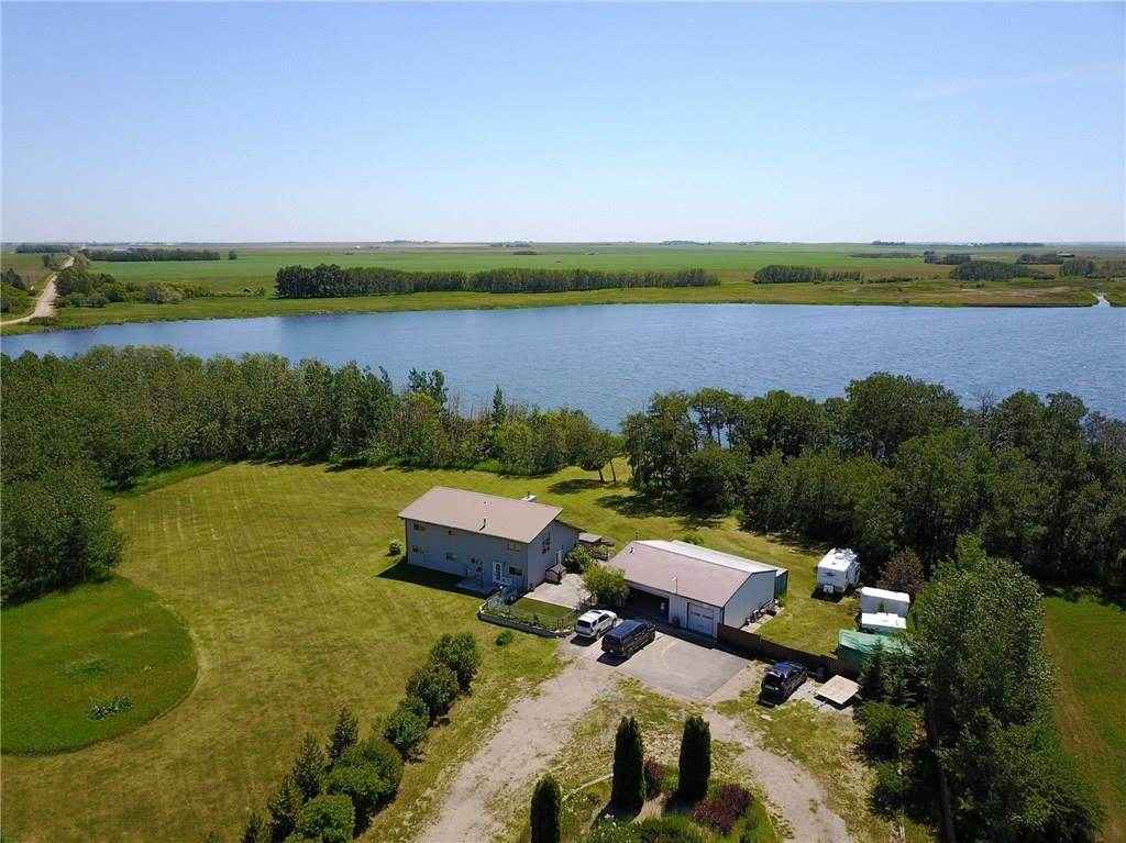 Aerial shot! We have since extended the garage on the right and added a chicken coup & garden + greenhouse out front.