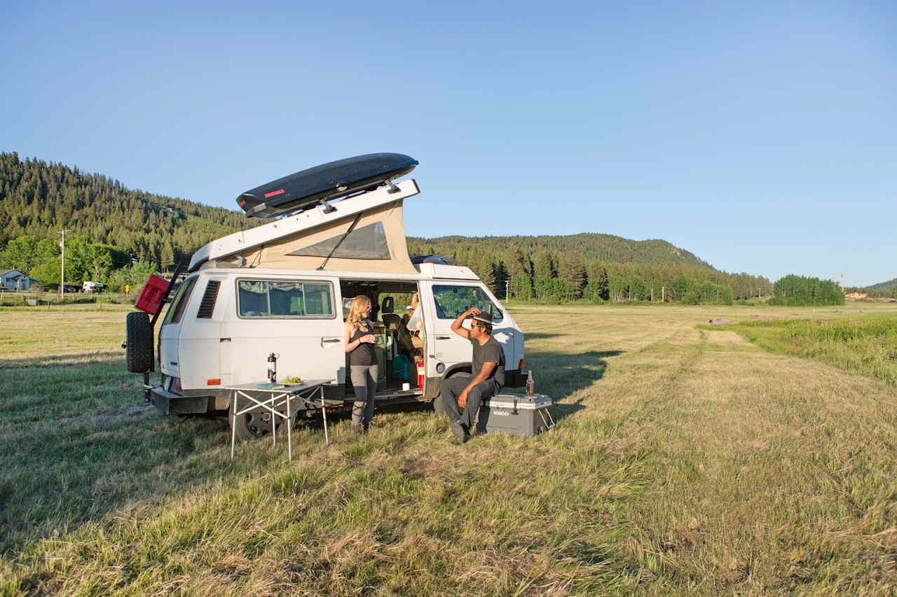 Enjoying the sunset with a beverage by the van. 