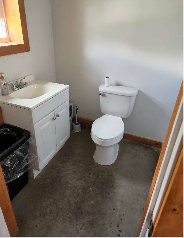 This half bath is located in our artisan bakery, which is a short, walk or drive from the cabin!