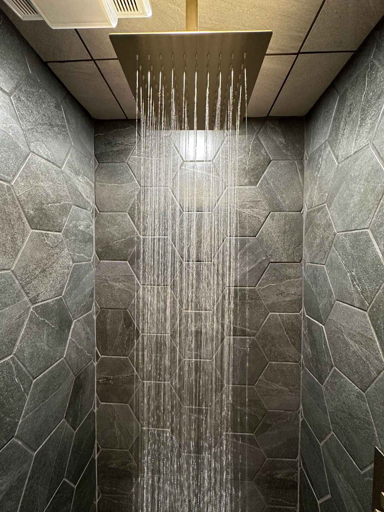 Enjoy the rainfall shower head in this spa-like environment.