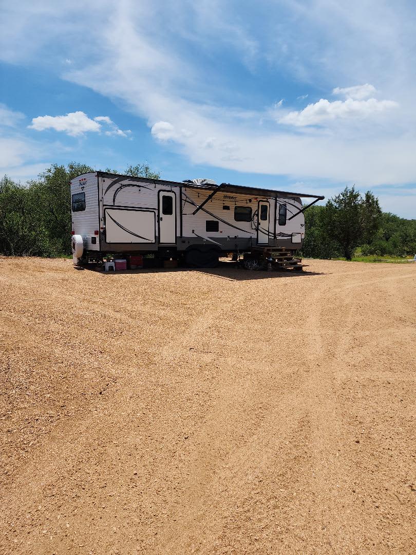 Our RV at our Favorite spot on a crushed granite pad.