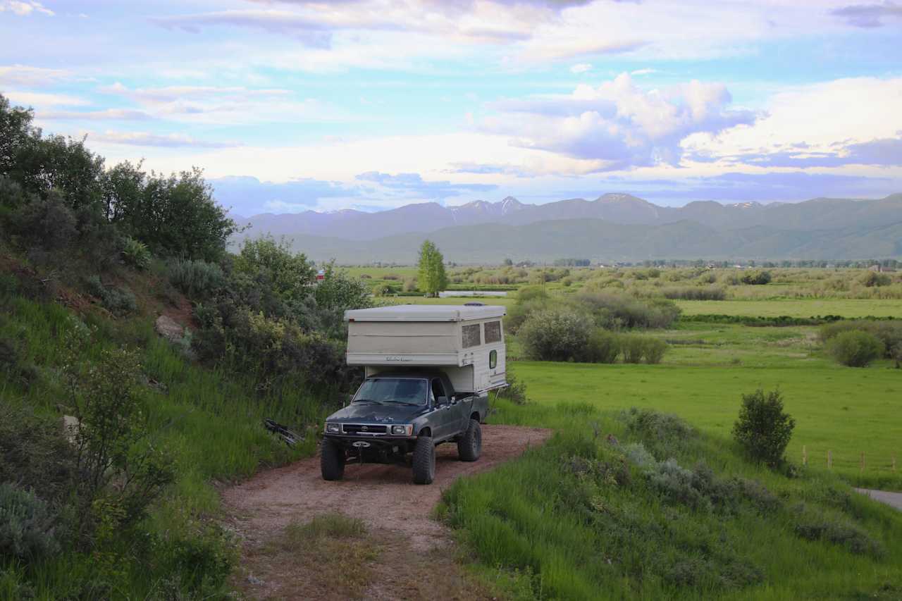 Camping pad with truck camper.