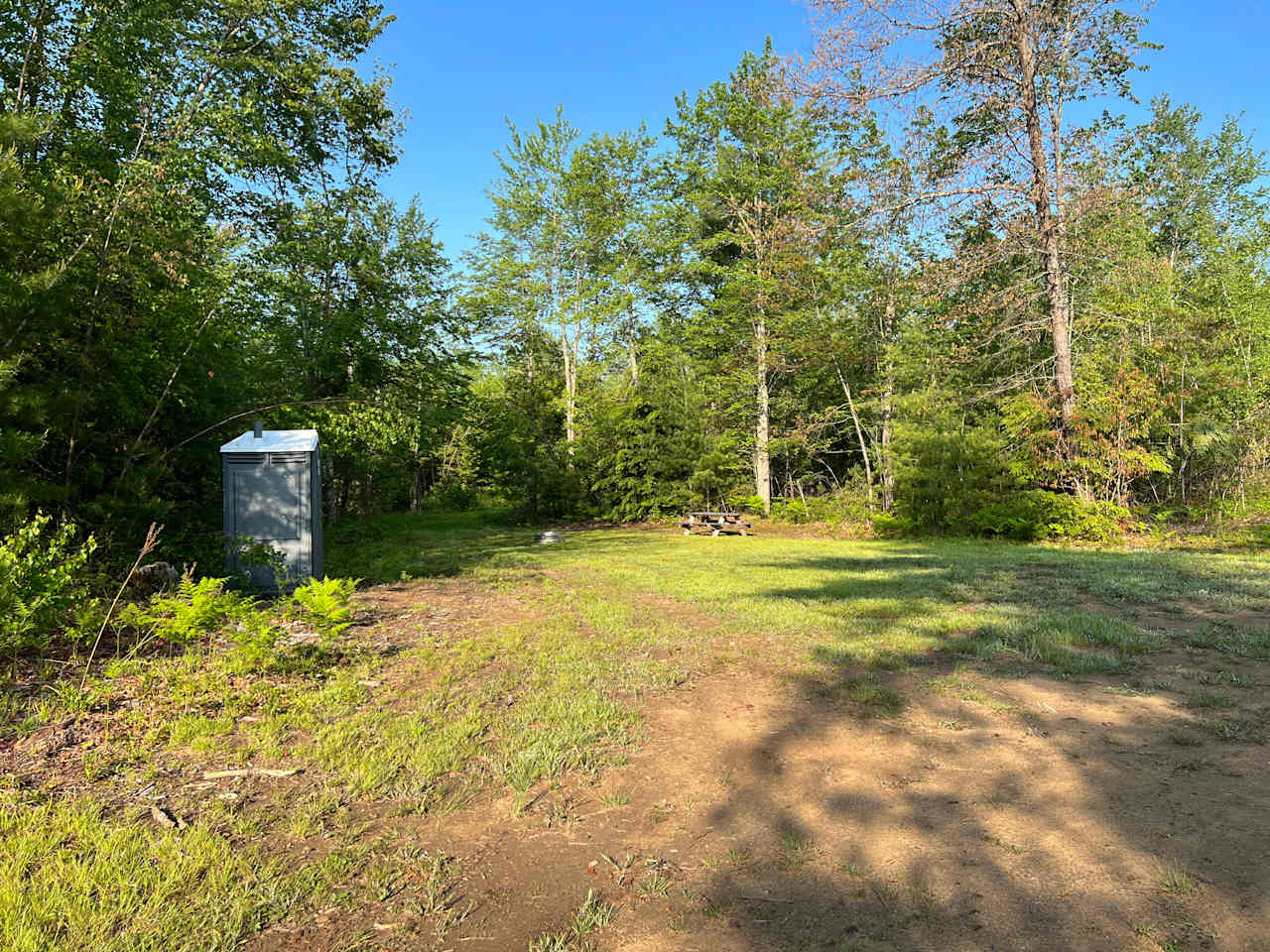 Site #1 -RV or bring your own tent/camper. Open site with picnic table, firepit and chemical toilet