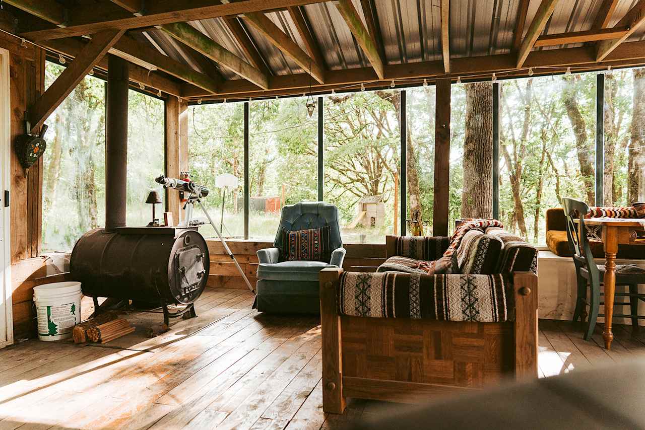 Warm and cozy wood burning stove inside of the glass house. 