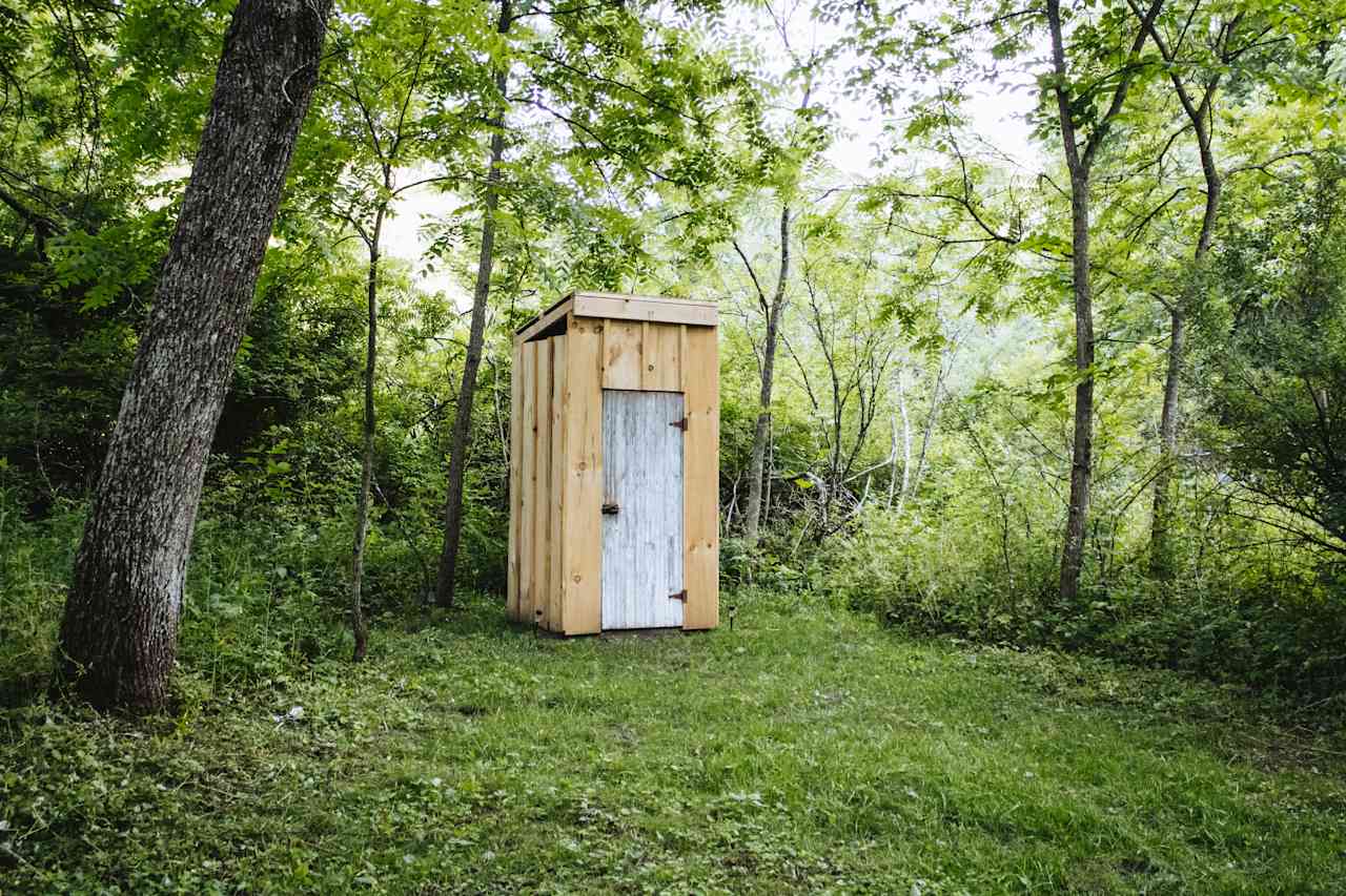 Clean outhouse with lights to help you see once it’s dark 