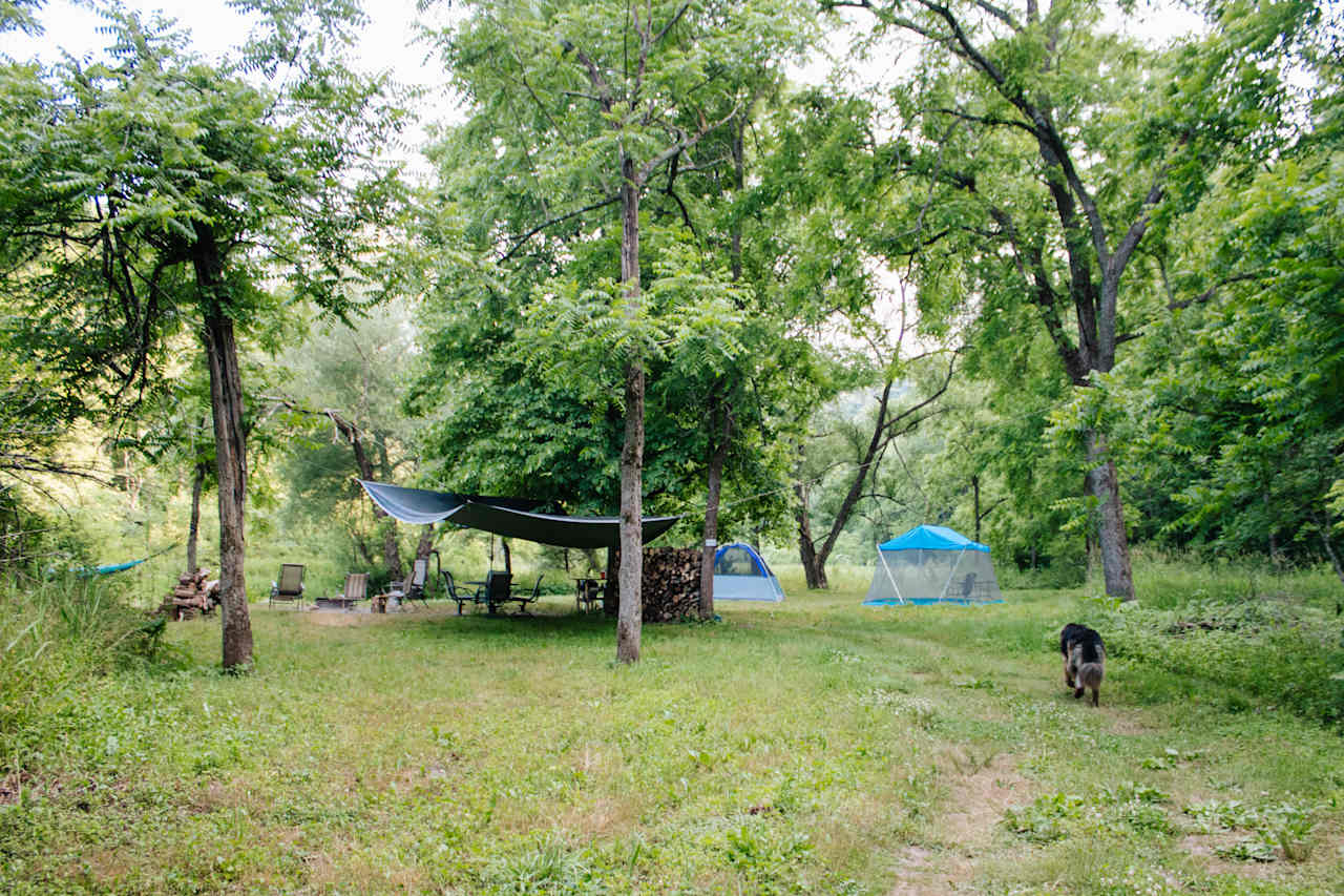 Walking into the site after a visit to the swimming hole/rock whirlpool. 