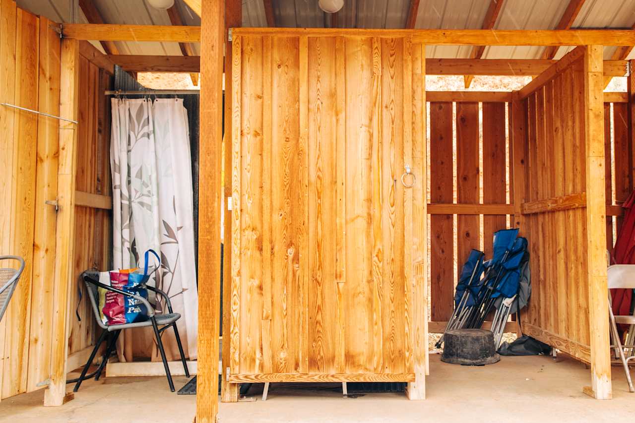 There are two stalls and hooks and a chair are provided. 