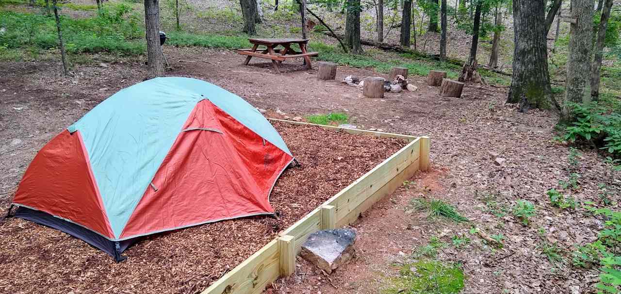 Large flat tent pad.