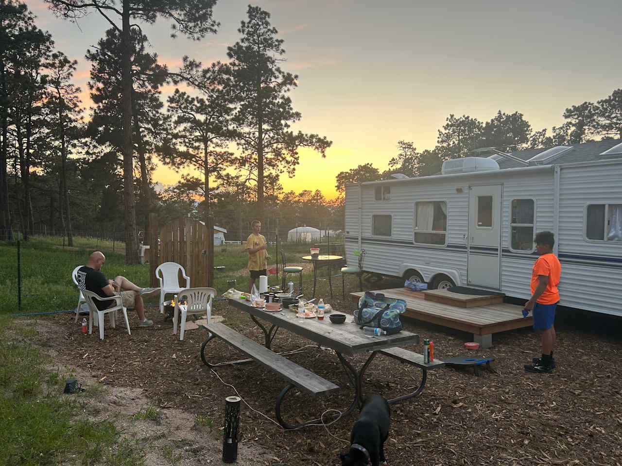 Gas fire pit, nice picnic table and plenty of seating.